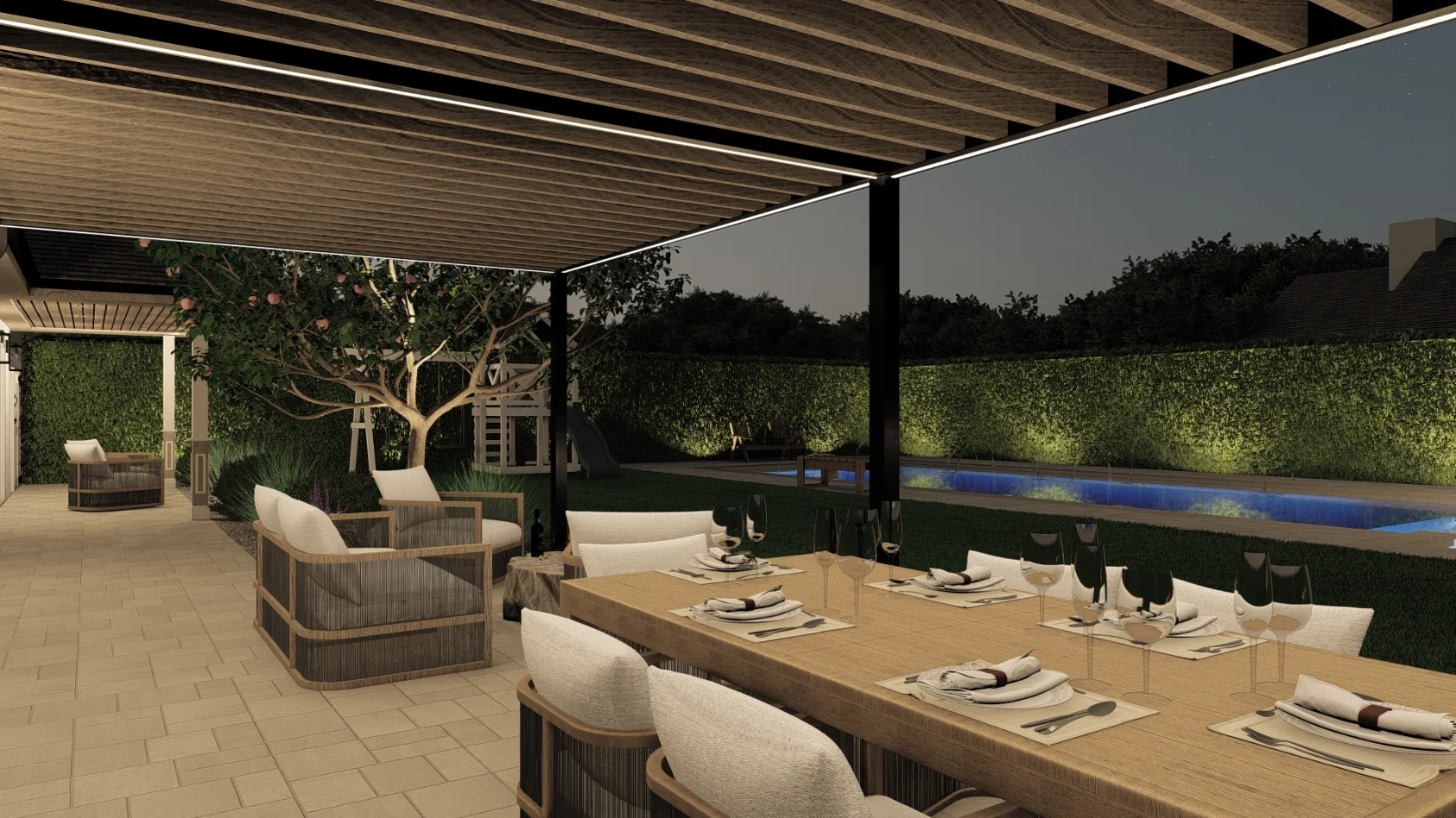 Outdoor patio with a wooden dining table and chairs under a pergola, lounge seating, a tree, and a backyard pool lit at night.