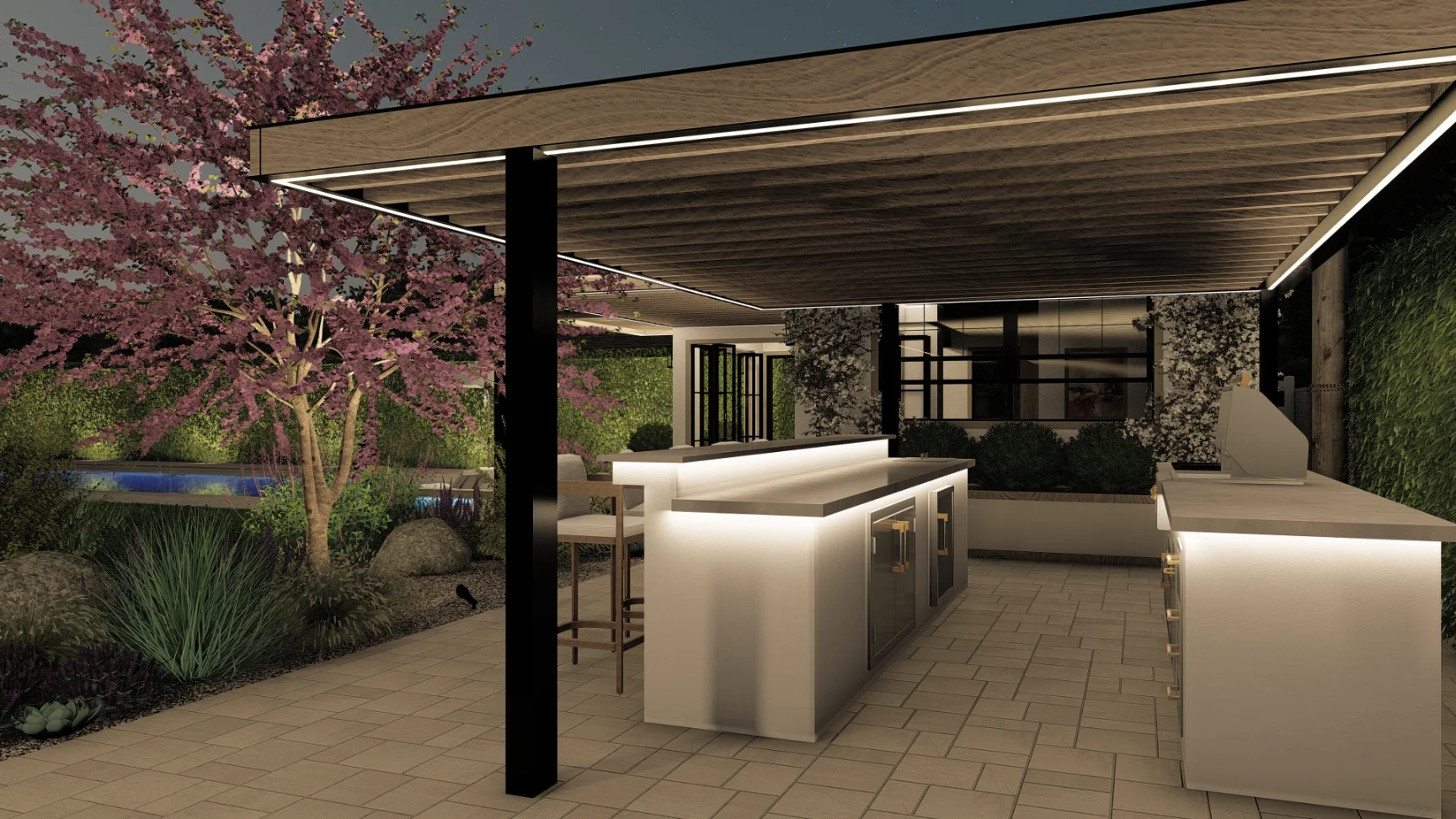 Modern outdoor kitchen under a pergola with sleek counters, bar stools, and integrated lighting; landscaped garden and pool are visible in the background.