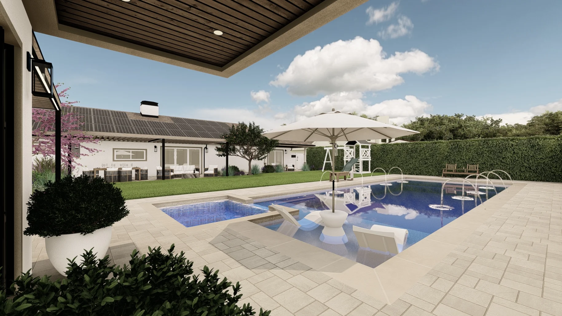 Modern backyard with a swimming pool, jacuzzi, poolside loungers, umbrellas, and landscaped lawn beside a single-story house under a blue sky with scattered clouds.